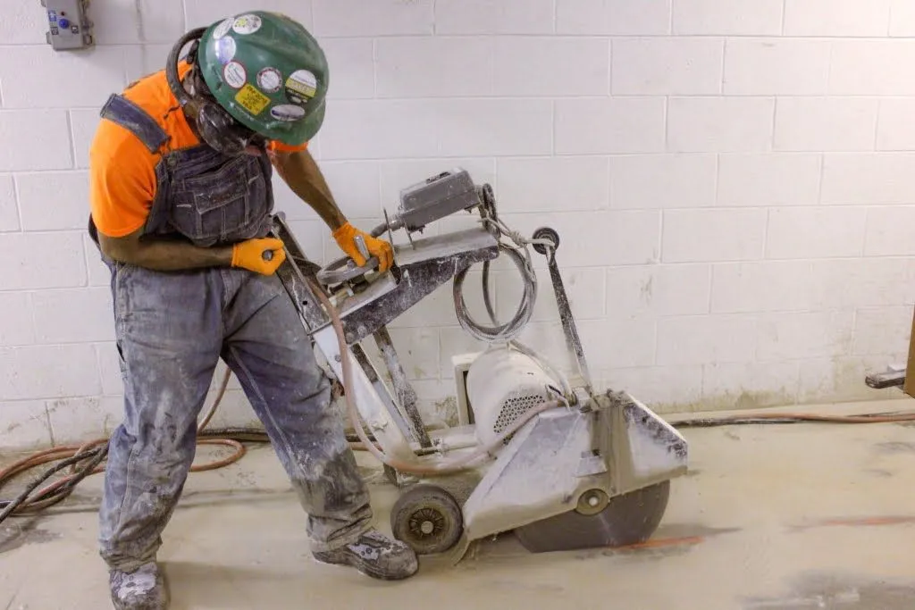 Saw cutting concrete wall